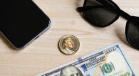 Trump’s face appears on $1 coin and his signature on the $100 bill as his team challenges the law